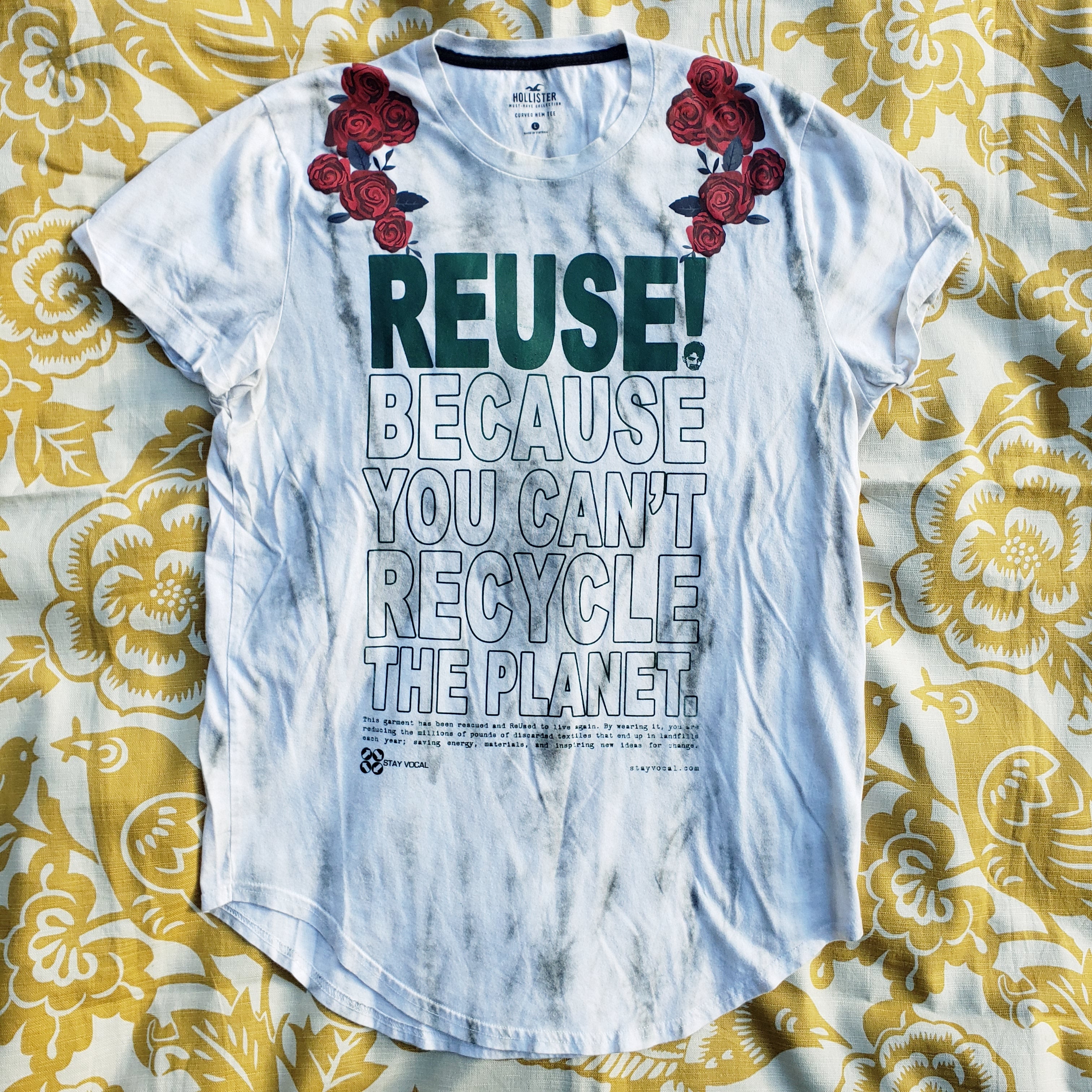 Eco friendly upcycled white with red roses T-Shirt that says Reuse Because You Can't Recycle The Planet.