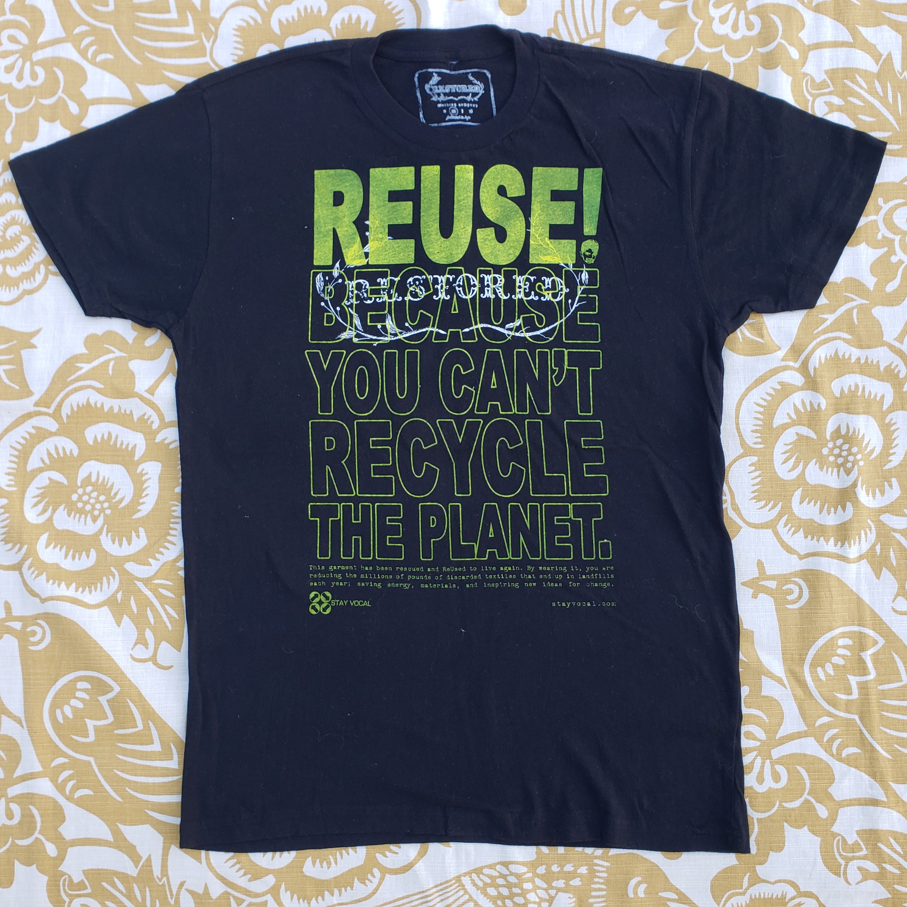 Eco friendly upcycled black Restored Clothing logo T-Shirt that says Reuse Because You Can't Recycle The Planet.