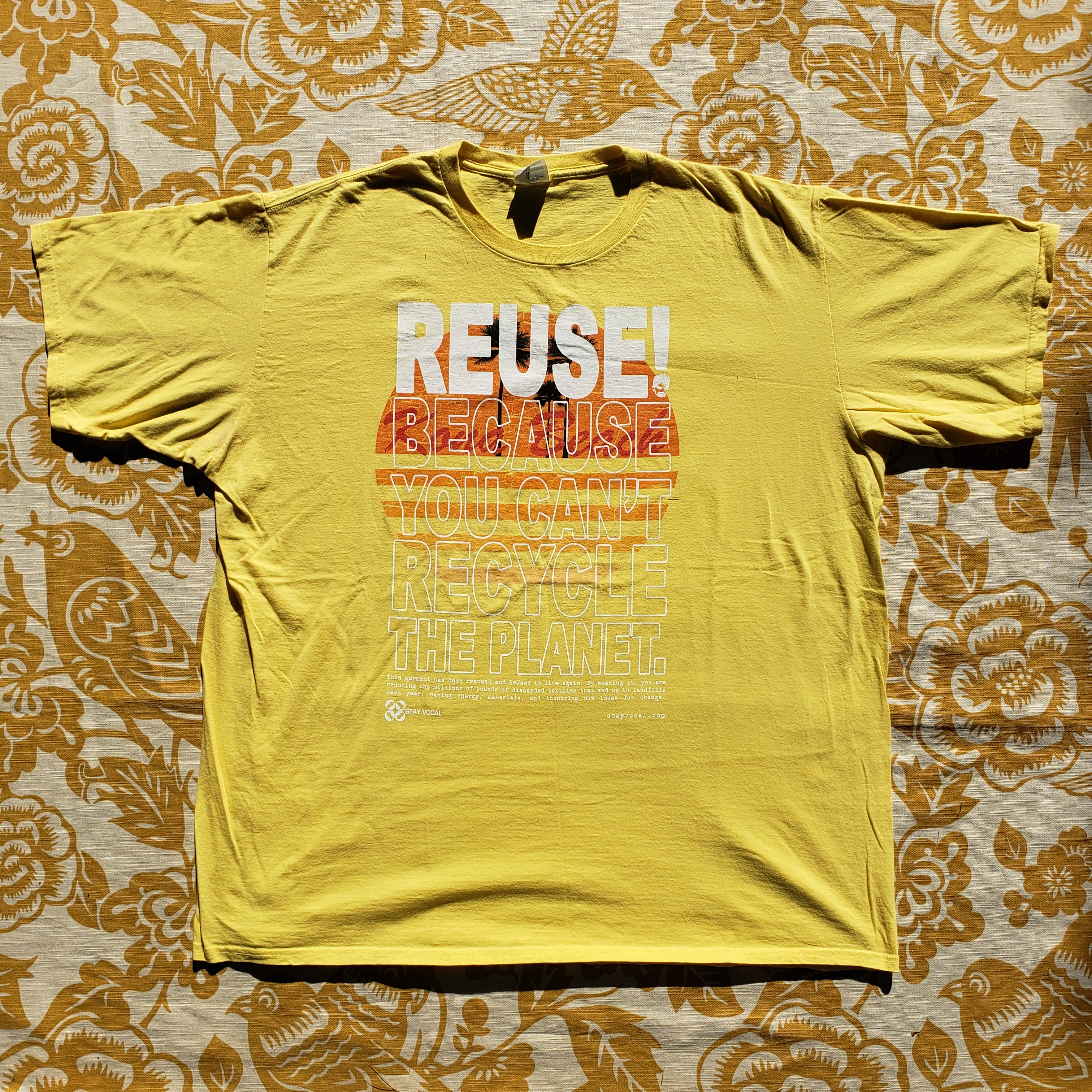 Eco friendly upcycled yellow Kona Beach T-Shirt that says Reuse Because You Can't Recycle The Planet.