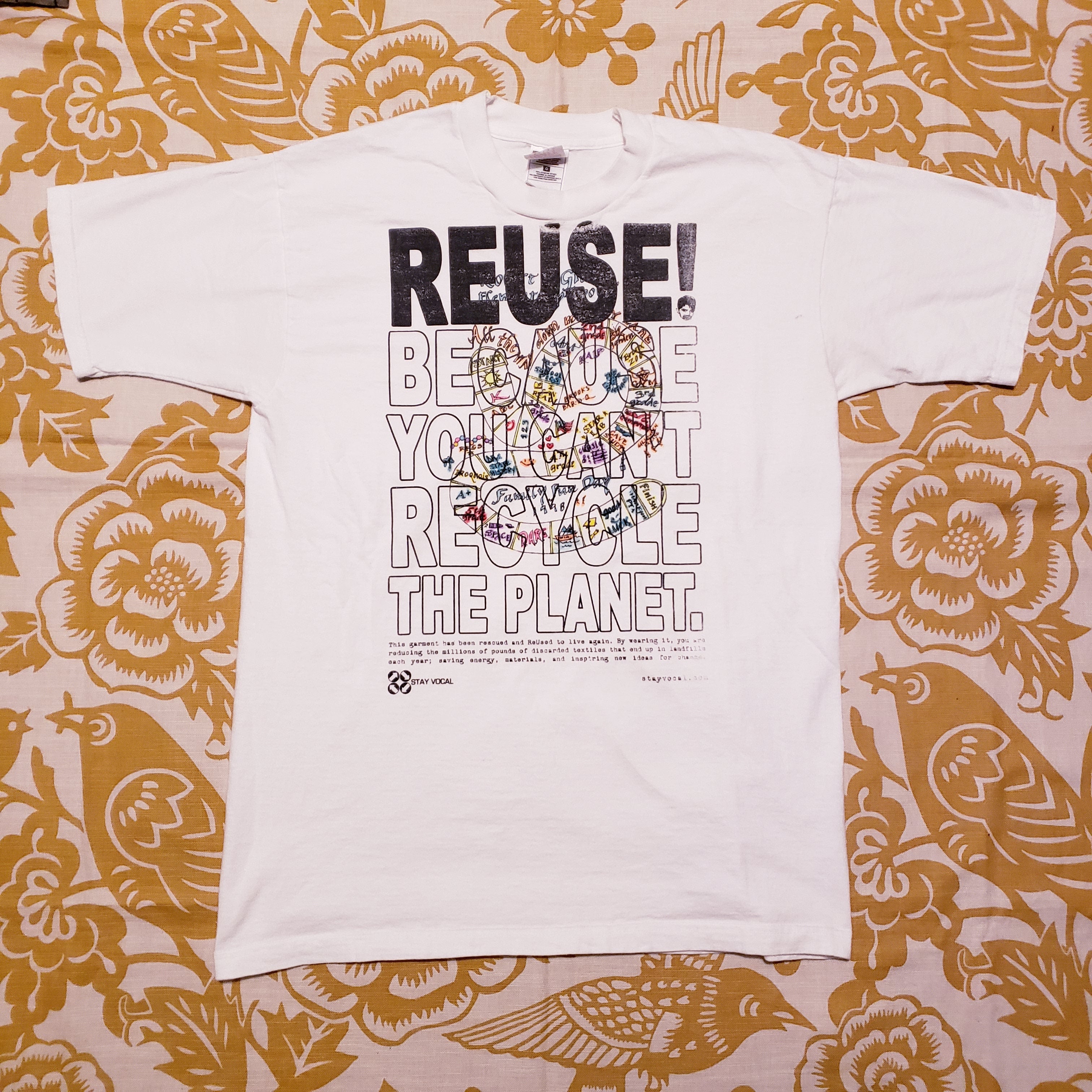 Eco friendly upcycled white handmade T-Shirt that says Reuse Because You Can't Recycle The Planet.