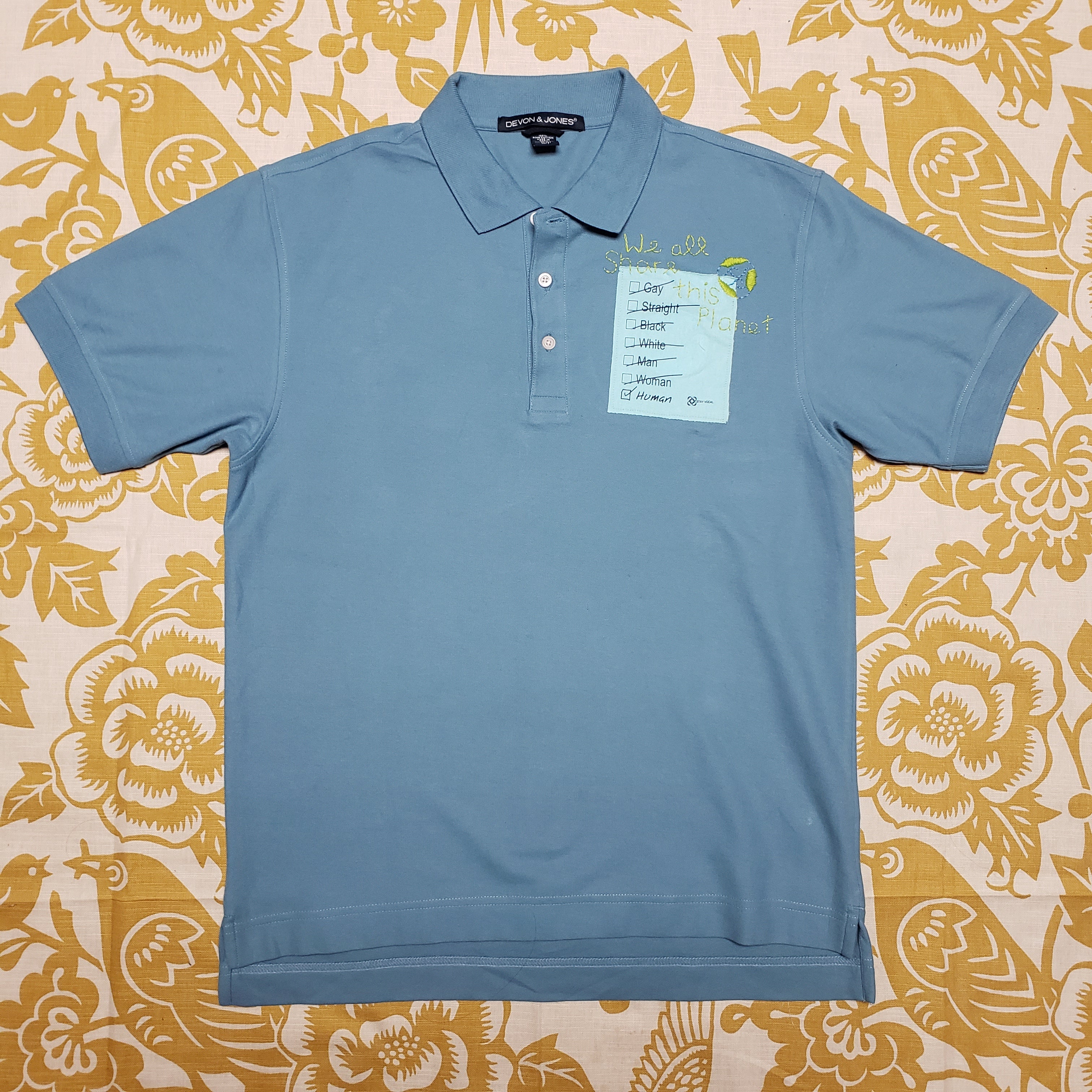 One of a Kind (Men's S) We All Share This Planet Polo by Carly Carte